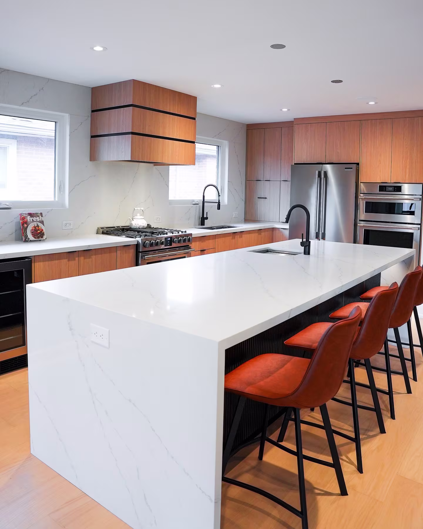 Luxury kitchen in Ontario featuring a white quartz waterfall island by Stone Valley Countertops