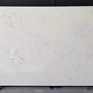 White quartz slab with scattered light gray veining and subtle marbled texture