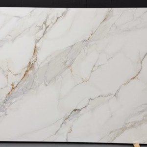 Printed Calacatta Gold quartz slab with white background and striking gold and gray veining.