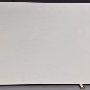 Casla Everest quartz slab with soft white background and faint flowing vein patterns.