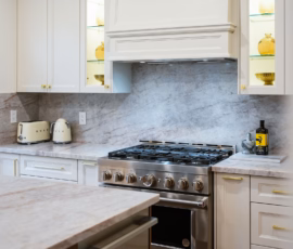 Taj Mahal Quartz kitchen island featuring warm gold veining, soft movement, and a smooth polished surface.