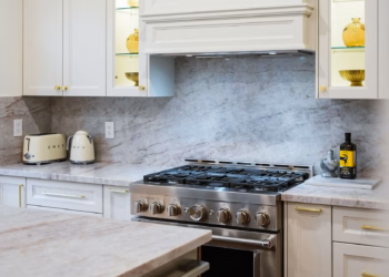Taj Mahal Quartz kitchen island featuring warm gold veining, soft movement, and a smooth polished surface.