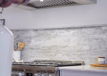 Modern kitchen featuring HanStone Matterhorn quartz countertops with a full island and matching backsplash installed by Stone Valley Countertops.