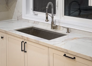 Lupas quartz countertop with an undermount sink and modern pull-down faucet in a bright kitchen setting.
