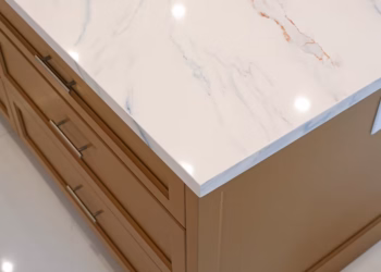 Close up of MSI Calacatta Lapiza quartz island corner installed by Stone Valley Countertops in Oakville Ontario showing polished edges and soft marble inspired veining