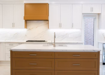 Front view of a custom kitchen island featuring MSI Calacatta Lapiza quartz installed by Stone Valley Countertops in Oakville Ontario with full height quartz backsplash and polished finish