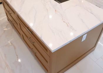 MSI Calacatta Lapiza quartz kitchen island with integrated sink installed by Stone Valley Countertops in Oakville Ontario featuring soft marble style veining and a polished finish