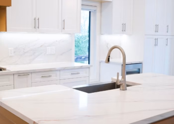 Wide view of a modern kitchen featuring MSI Calacatta Lapiza quartz countertops and backsplash installed by Stone Valley Countertops in Oakville Ontario with seamless fabrication and polished finish