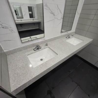 Durable quartz countertops installed in commercial OnRoute Port Hope public washroom