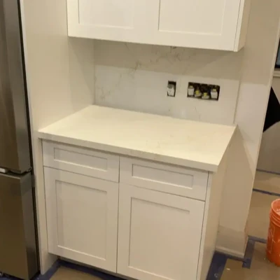 Custom quartz coffee bar countertop with backsplash installed in Bewdley Ontario home