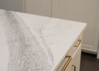 Cambria Windsor Brass Satin Ridge quartz kitchen island edge detail with visible veining and brass cabinet hardware in Mississauga
